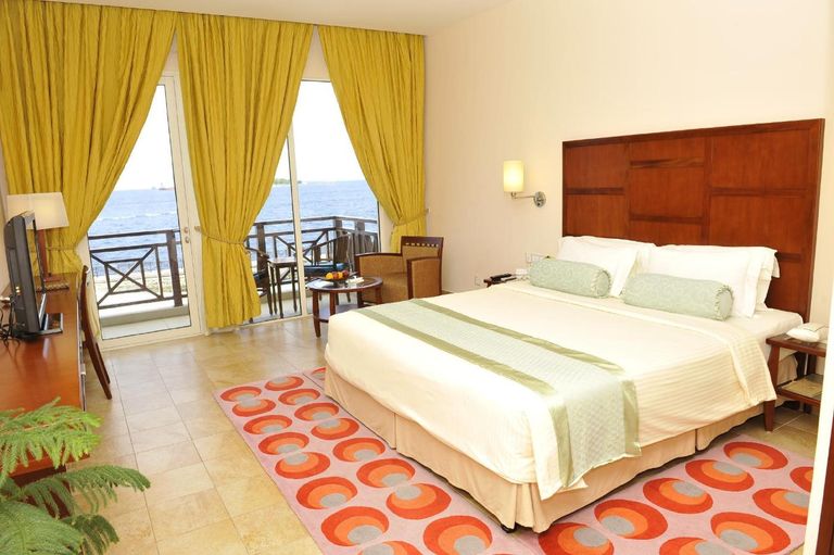 Hulhule Island Hotel with Private Beach at Velana International Airport – Free Return Transfer