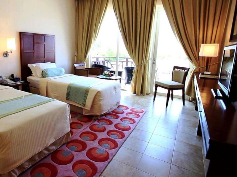Hulhule Island Hotel with Private Beach at Velana International Airport – Free Return Transfer